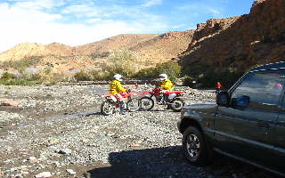 Motorbike tour: crossing river in the Atlas mountains